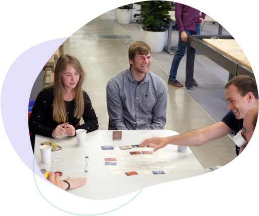 Photo of Ginger Labs employees playing a card game